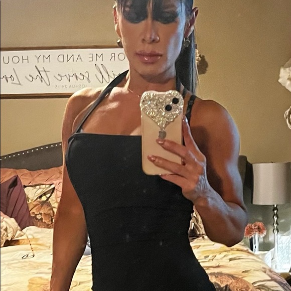 This beautiful black dress is stunning. It’s fitted and a head turner for sure - Picture 2 of 2